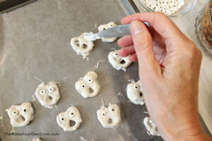 Making ghost pretzel halloween treats
